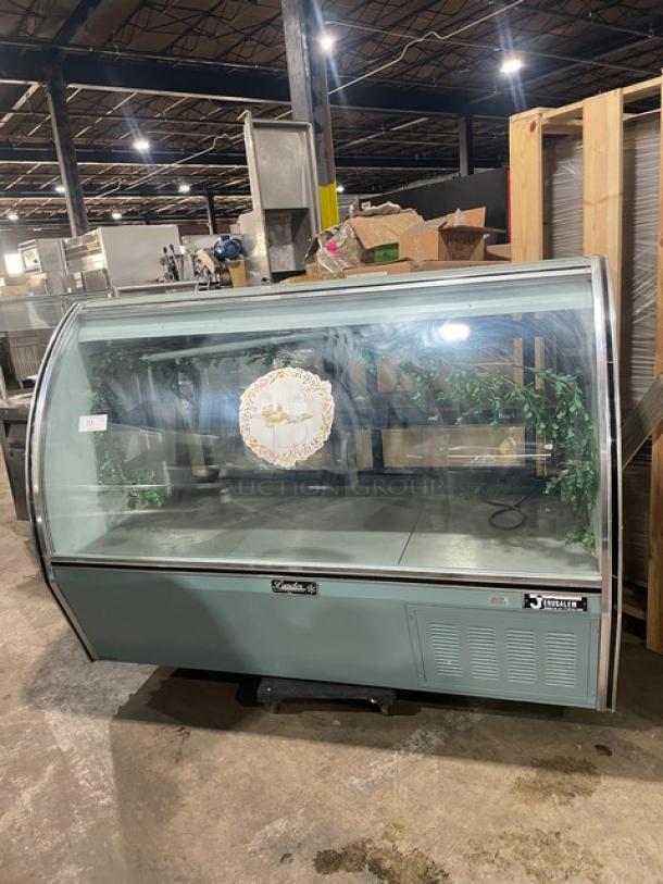 Leader NRHD72SC 72" refrigerated deli display case with curved glass, rear sliding doors, and lower storage. Model PW01M1703a.