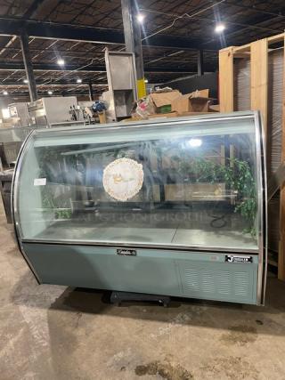 Leader NRHD72SC 72" refrigerated deli display case with curved glass, rear sliding doors, and lower storage. Model PW01M1703a.