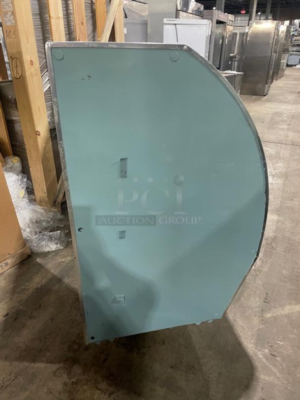 Leader Commercial 72" curved glass refrigerated deli display case, Model NRHD72SC. Includes rear sliding doors, overstock compartment, 115V, 1 phase.