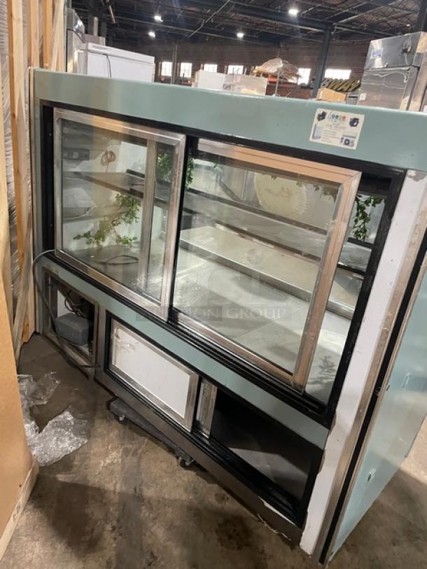 Leader NRHD72SC 72" Curved Glass Refrigerated Deli Merchandiser, rear sliding doors, lower overstock compartment, used.