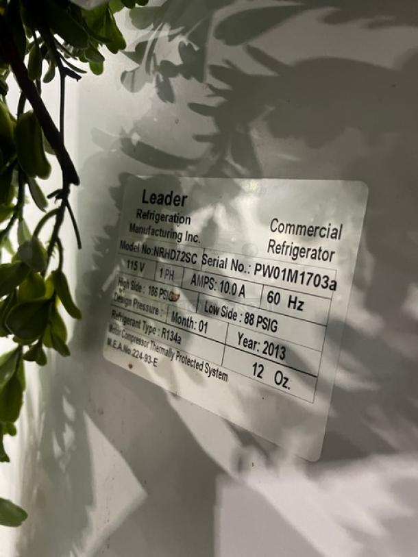 Leader Commercial 72" refrigerated deli display, model NRHD72SC, with curved glass, rear sliding doors, and overstock compartment.