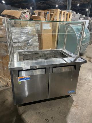 Turbo Air MST-48-18 stainless steel refrigerated prep table with sneeze guard, dual doors, and casters; commercial use.