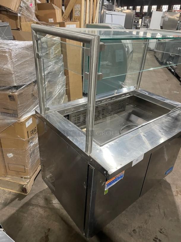 Turbo Air M3 Series 2 Door Refrigerated Prep Table, Model MST-48-18, with sneeze guard, stainless steel, on casters.