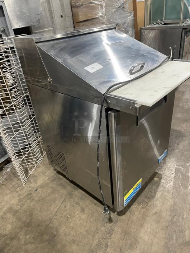 Turbo Air MST-28-12 refrigerated prep table, stainless steel, single door, with cutting board, poly rack, on casters.