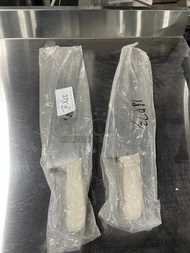 Dexter Russell Sani-Safe 18” pizza knife, model S160-18, new in packaging with white grip handle, stainless steel blade.