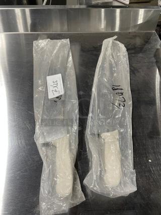 Dexter Russell Sani-Safe 18” pizza knife, model S160-18, new in packaging with white grip handle, stainless steel blade.