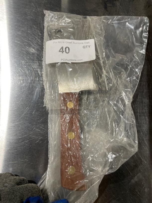 Dexter Russell 7” cleaver, model S5287, with rosewood handle, in original packaging. New condition, stainless steel blade.