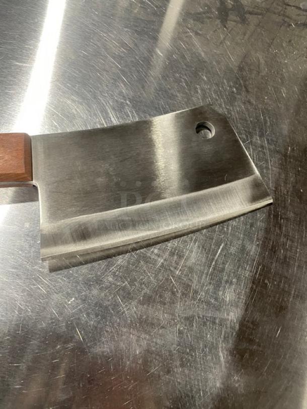 Dexter Russell 7” stainless steel cleaver, model S5287, with rosewood grip handle. New condition, durable blade.