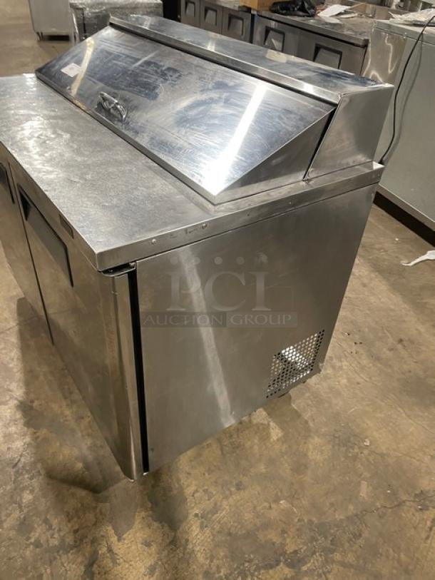 Turbo Air MST-48-N stainless steel 2-door refrigerated prep table with poly-coated rack, 115V, on casters, good condition.