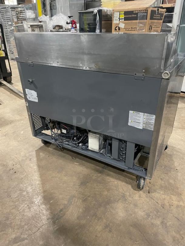 Turbo Air MST-48-N stainless steel refrigerated prep table with two doors, poly-coated rack, and casters. Model: MST48N.