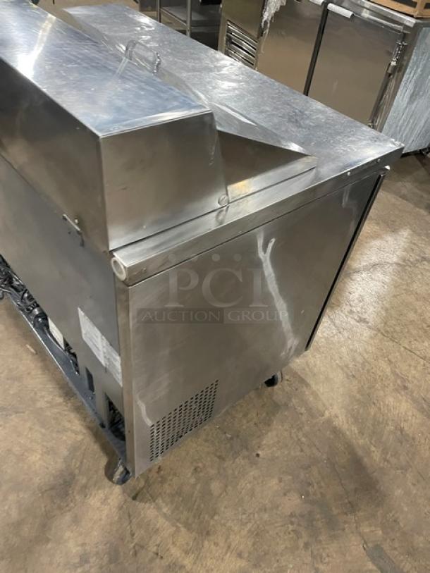 Turbo Air MST-48-N stainless steel two-door refrigerated salad/sandwich prep table on casters, with poly-coated rack.
