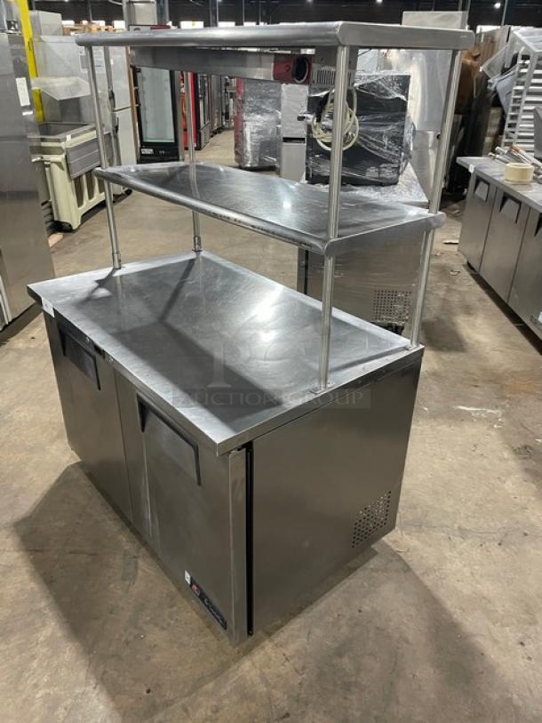 True TUC-48 stainless steel 2-door worktop refrigerator, Energy Star certified, with double overhead shelf, Avantco heat lamp, poly-coated wired rack, on casters.