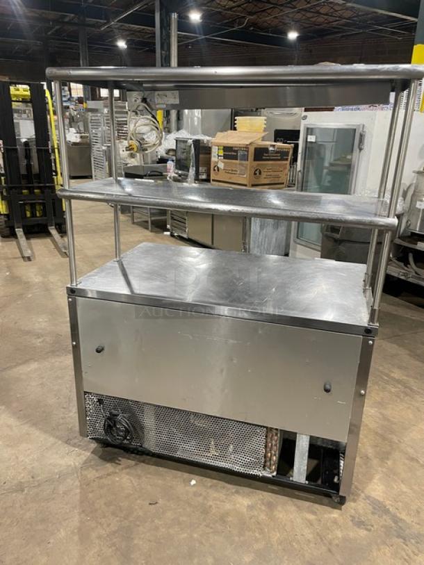 True TUC-48 Worktop Refrigerator, stainless steel, 48", Energy Star, double overhead shelf, Avantco heat lamp, on casters.