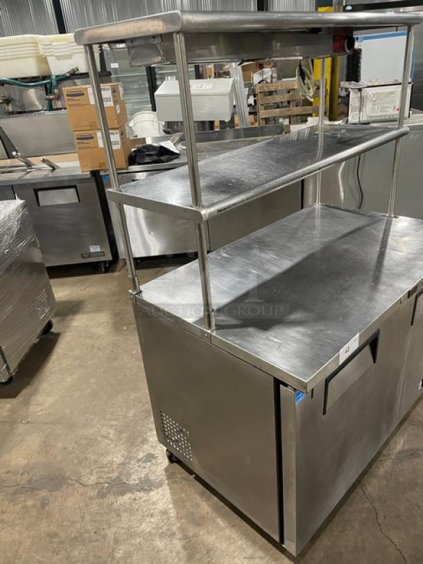 True 2-Door Stainless Steel Worktop Refrigerator, Model TUC-48, with double overhead shelf, Avantco heat lamp, poly-coated rack.