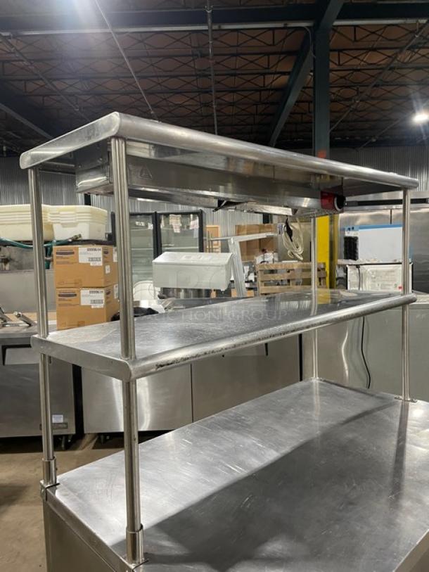 True TUC-48 stainless steel 2-door worktop refrigerator with double overhead shelf, Avantco heat lamp, and poly-coated rack.