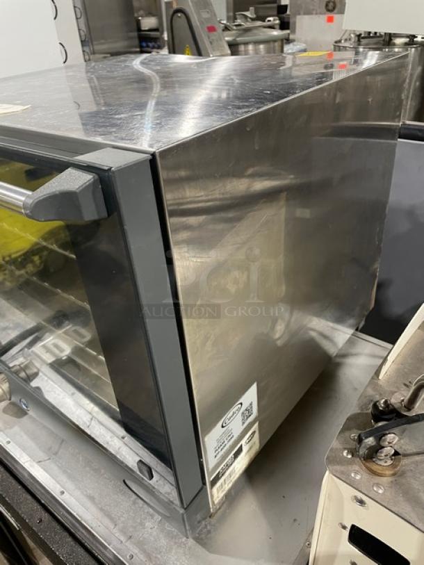 Cadco XAF023 countertop convection oven, stainless steel, with wired rack. Model XAF023, SN: 2019B0013859, 240V.