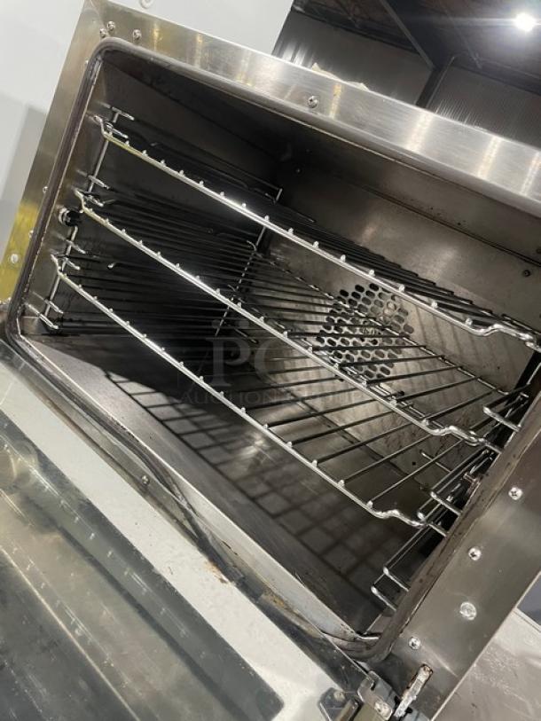 Cadco Anna Series XAF023 convection oven with wired rack, half-size, stainless steel, electric, on legs, 240V, commercial use.
