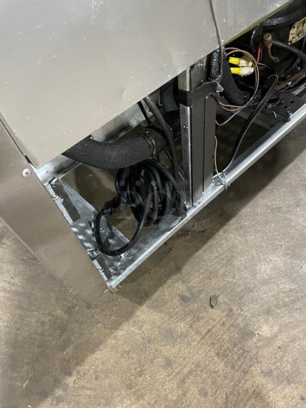 True TUC-48D-4 Commercial 4-Drawer Stainless Steel Undercounter Refrigerator, 115V, on casters, shown with visible wiring.