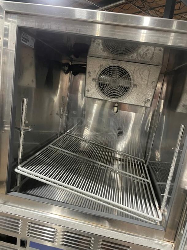 Follett REF Series stainless steel medical-grade undercounter refrigerator, model REF5, with poly-coated wired rack, shown open.