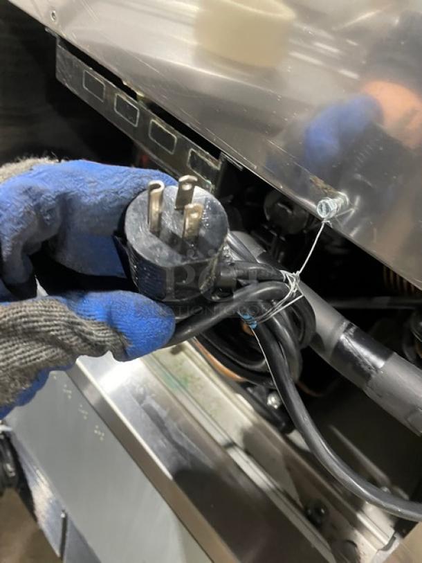 Follett REF5 medical-grade stainless steel undercounter refrigerator plug view, model REF5, SN: E14011-27113, 115V, 1 phase.