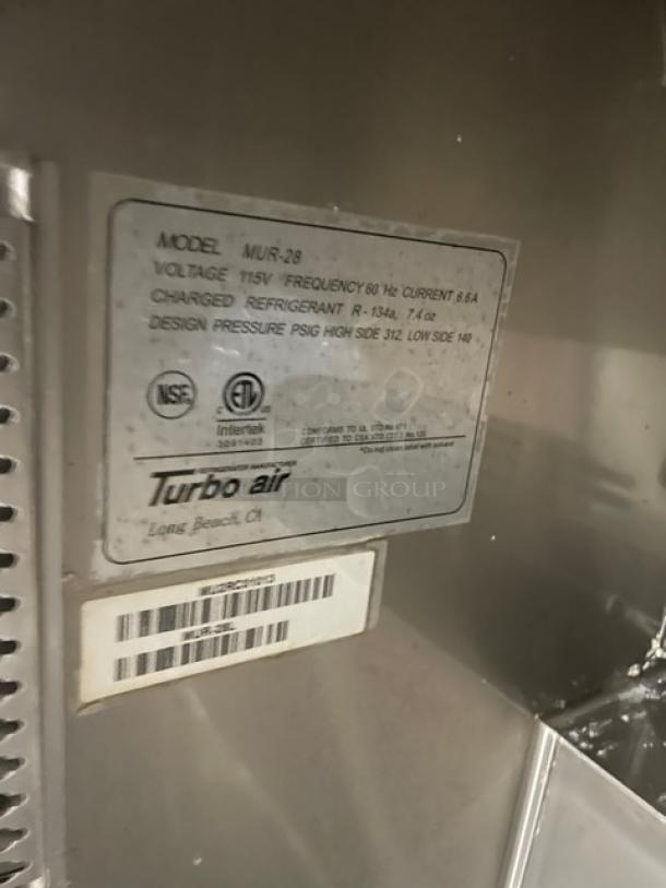 Turbo Air MUR-28 undercounter refrigerator nameplate showing model, voltage, refrigerant details, and compliance logos.