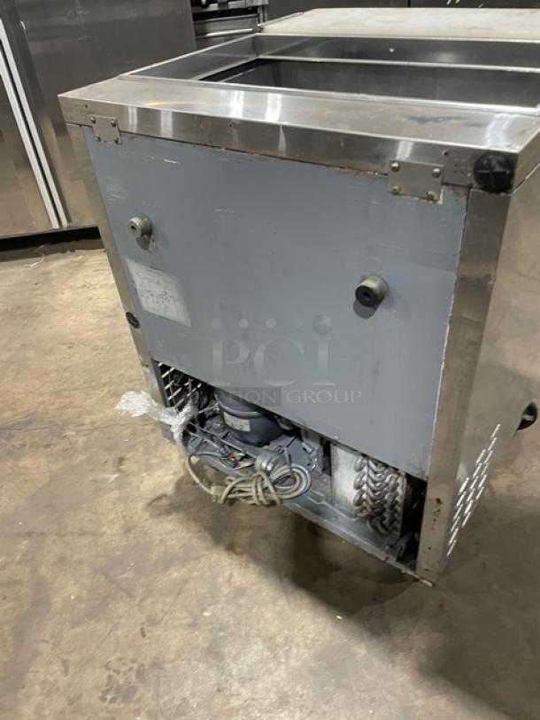 Turbo Air TST-28SD refrigerated prep table, stainless steel, single door, with cutting board, on casters, 115V.