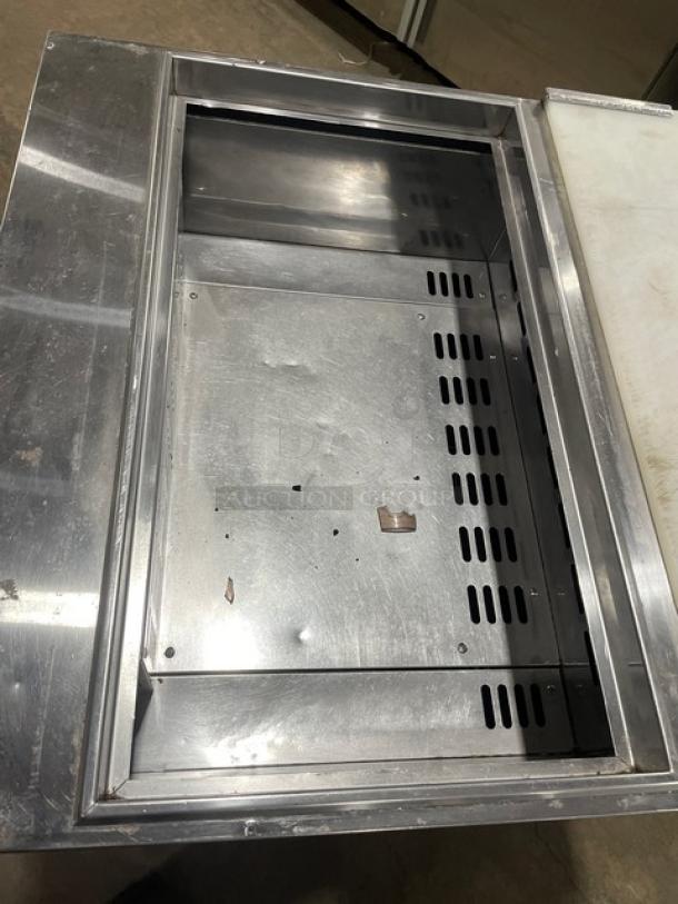 Turbo Air TST-28SD prep table with stainless steel surface, refrigerated compartment, and cutting board. Good condition.