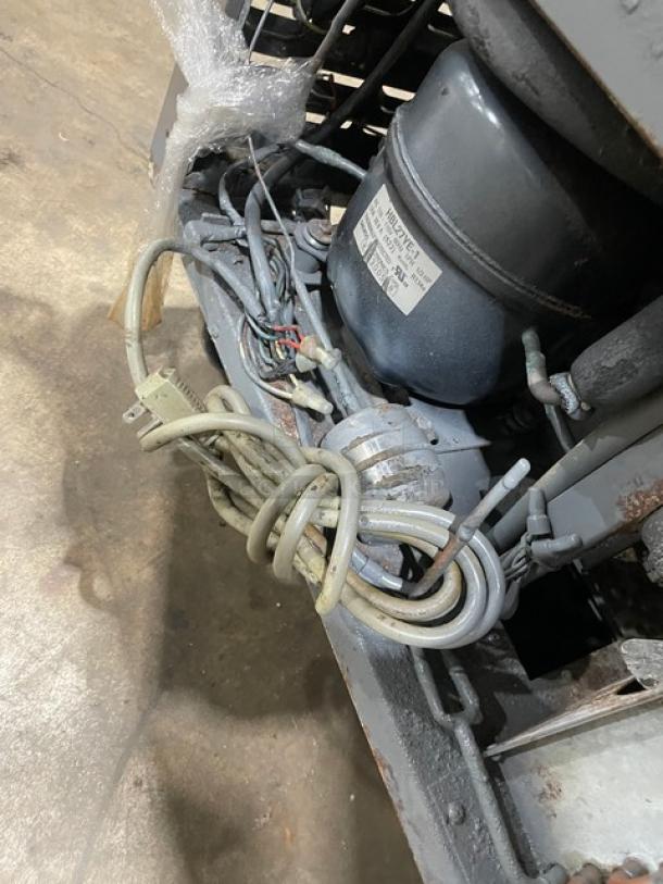 Turbo Air TST-28SD refrigerated prep table, stainless steel, single door, with cutting board, on casters, 115V.