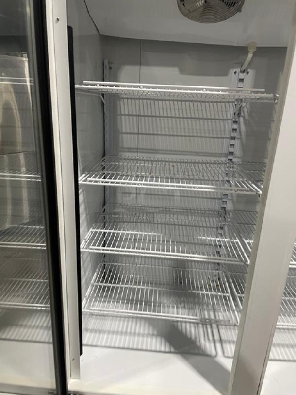 Master-Bilt BLG-52HD commercial refrigerator with double glass doors, poly coated wire racks, and serial number 302M00006Z.