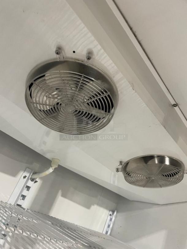 Master-Bilt BLG52HD commercial refrigerator interior view, showcasing glass swing doors and poly-coated wire rack.