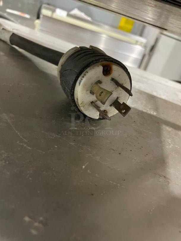 Convotherm OES610Mini commercial combi oven plug, 208/240V 3 phase, on stainless steel undershelf stand. Digital controls.