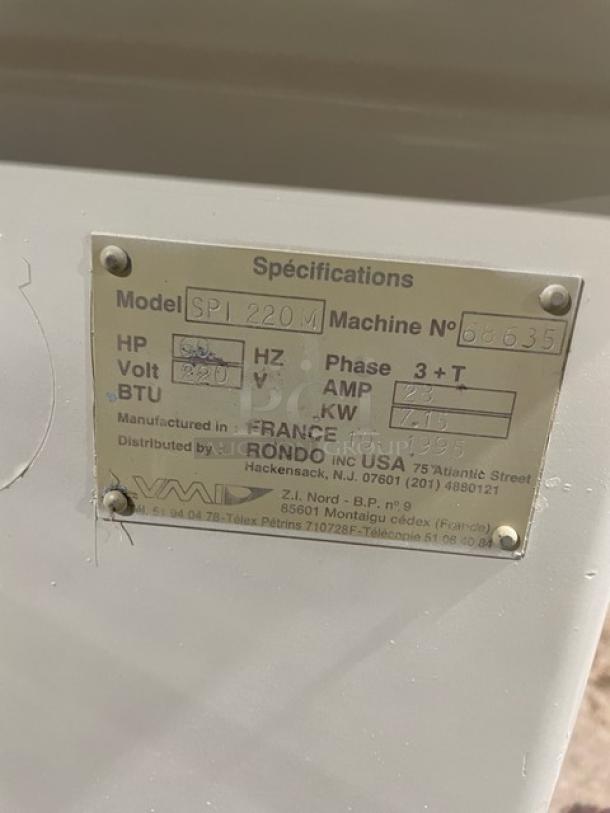 VMI SPI220M spiral mixer specification plate showing model, machine number, voltage 220V, 3-phase.