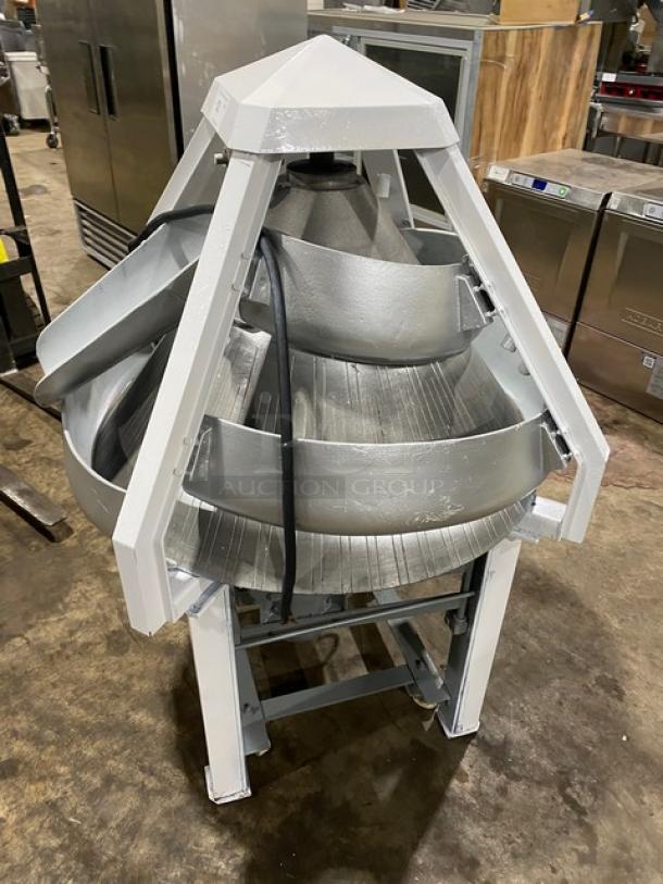 Benier commercial electric conical dough rounder on legs and casters, in good condition, for bakery use.