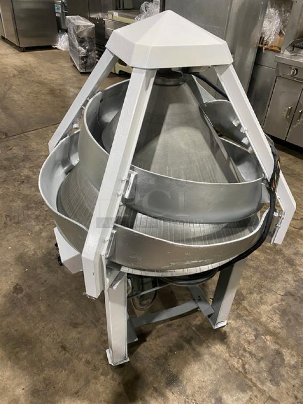 Benier commercial electric conical dough rounder on legs and casters, metal construction, used condition.