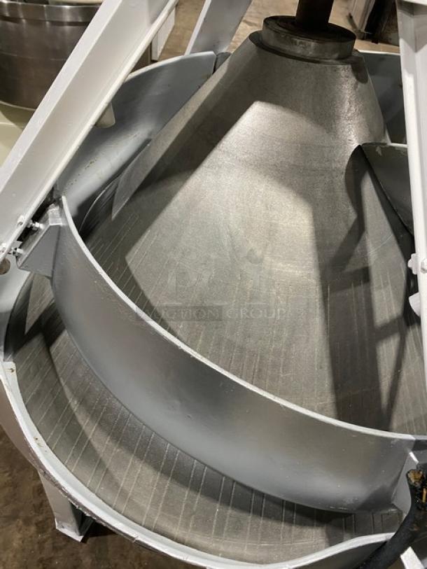 Benier commercial electric conical dough rounder, freestanding on legs and casters, in good condition.