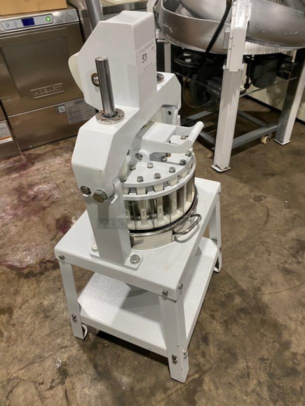 Migsa commercial white manual dough divider with single undershelf, sturdy metal construction, on legs, used condition.