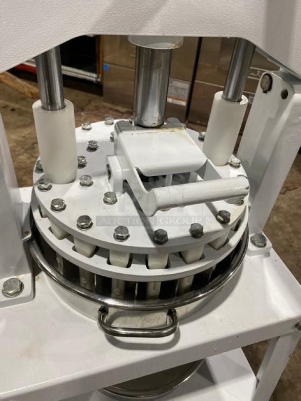 Migsa commercial manual dough divider with single undershelf on legs; white finish, robust metal construction, used condition.