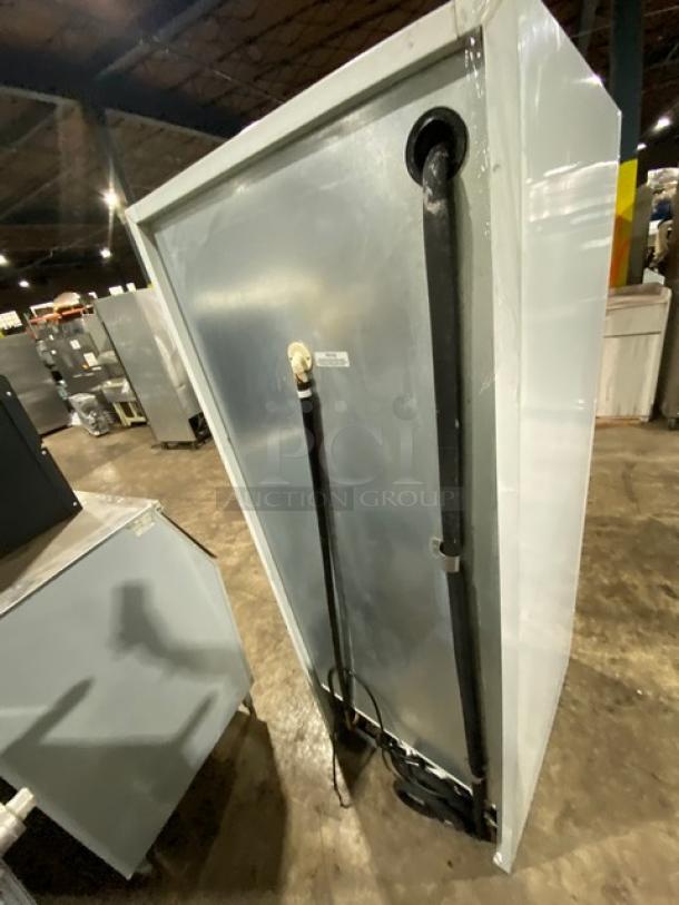 Carrier commercial reach-in refrigerator, model ULG30BS5, showing rear side with intact wiring and clean exterior.