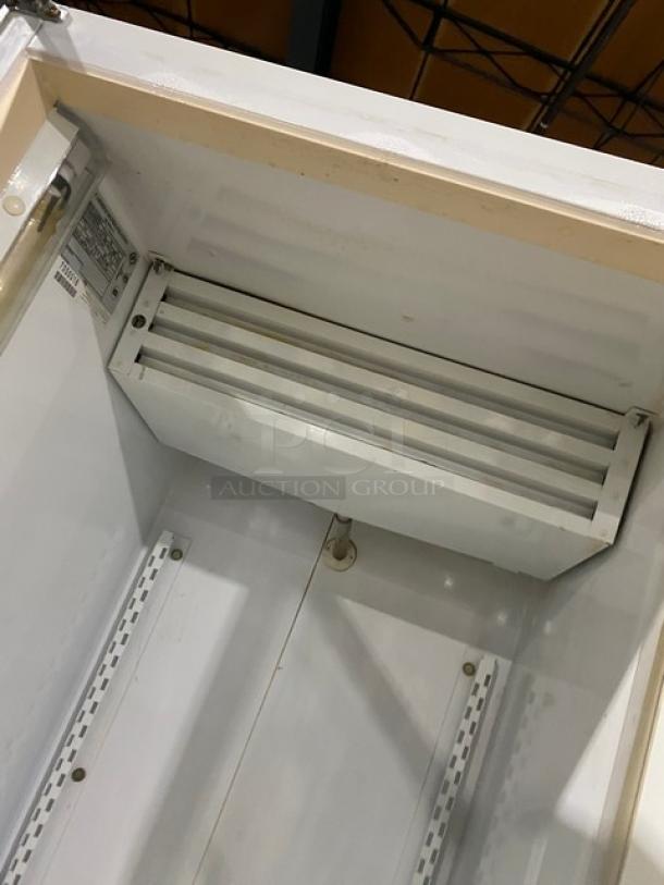 Carrier ULG30BS5 white reach-in merchandiser refrigerator with single glass swing door, poly coated wired rack. 115V, 1 phase.