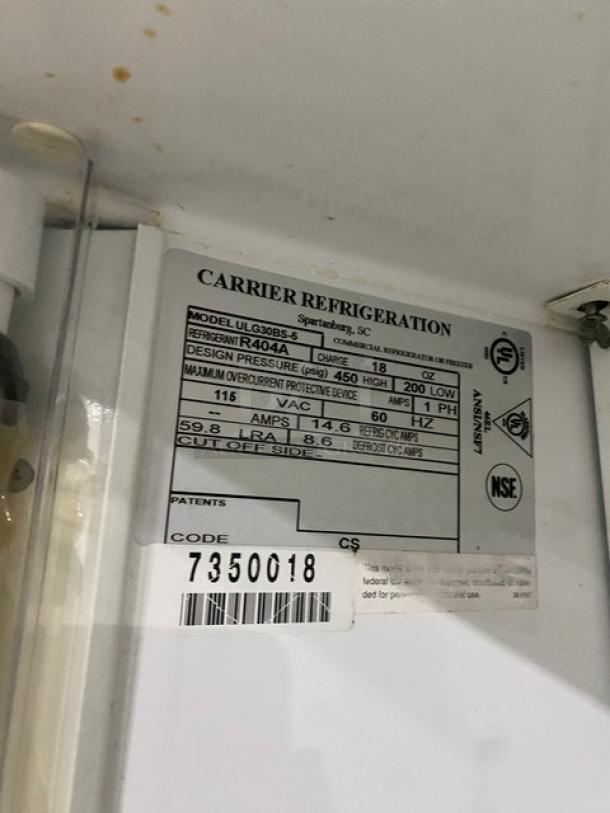 Carrier commercial refrigerator label, model ULG30BS-5, serial number 7350018, 115V, single phase, NSF certified.