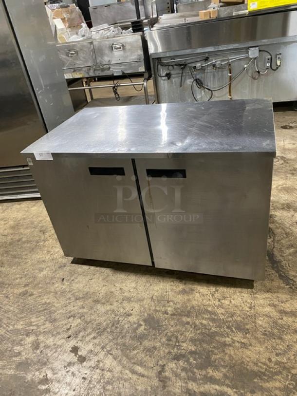 Delfield UC4048P-STAR stainless steel 2-door undercounter refrigerator with coated wired rack, on casters, 115V, 1 phase.