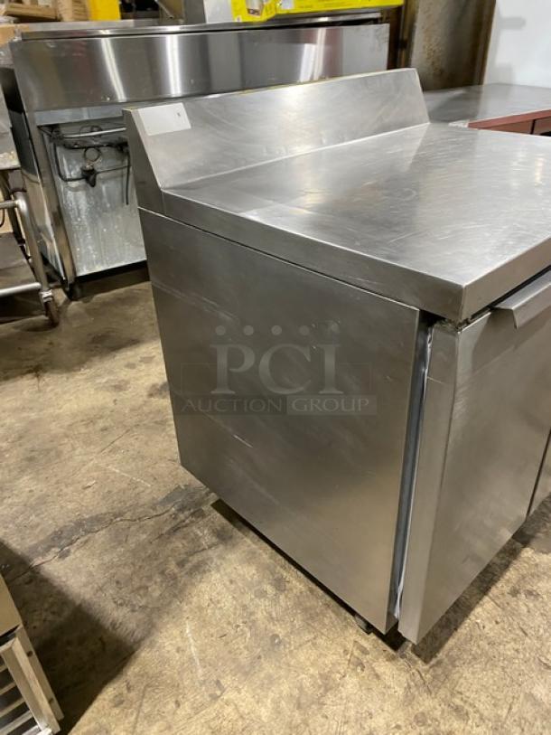 Continental SWF36BS stainless steel 2-door worktop freezer with up-turned backsplash, on casters, shown in good condition.