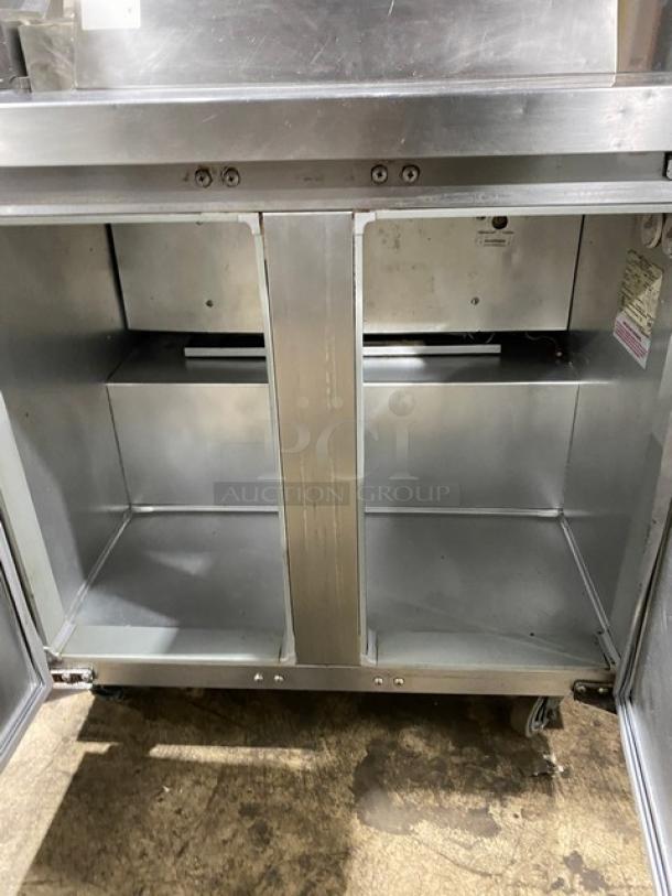 Continental SWF36BS worktop freezer, stainless steel, 2-door, upturned backsplash, on casters, 115V, commercial-grade.