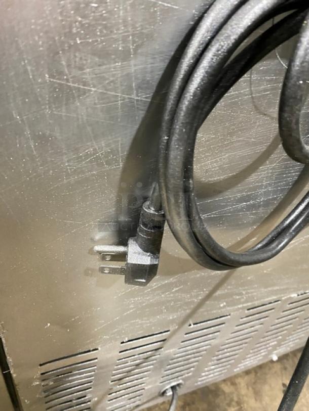 Continental SWF36BS stainless steel worktop freezer with upturned back splash. Features two doors, 115V, on casters.