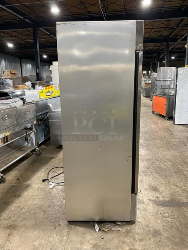 True T-49F commercial stainless steel solid 2-door reach-in freezer, poly coated wired rack, 115V, good condition.