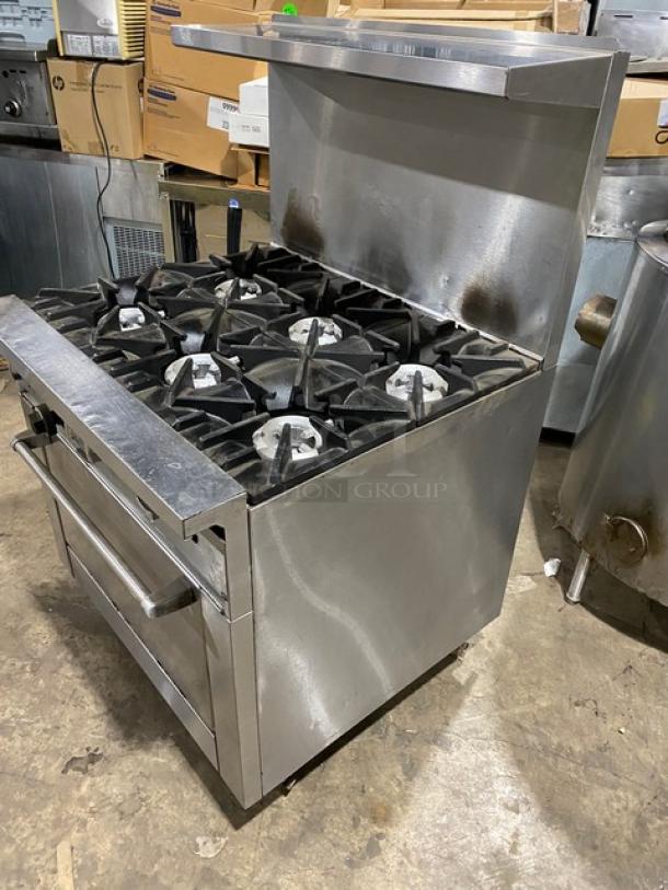 SunFire commercial stainless steel 6-burner range/oven combo, natural gas, with backsplash, salamander shelf, wired oven rack, on casters.