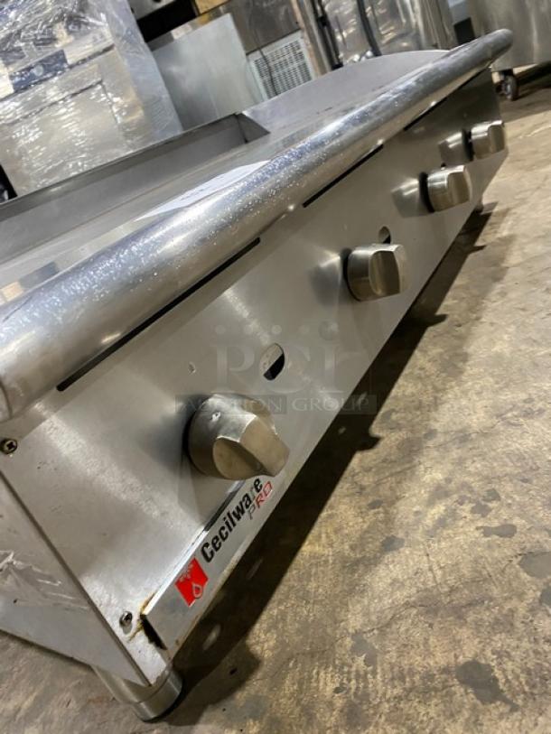 Cecilware Pro Series stainless steel countertop flat griddle, natural gas powered, with back and side splash, on legs.