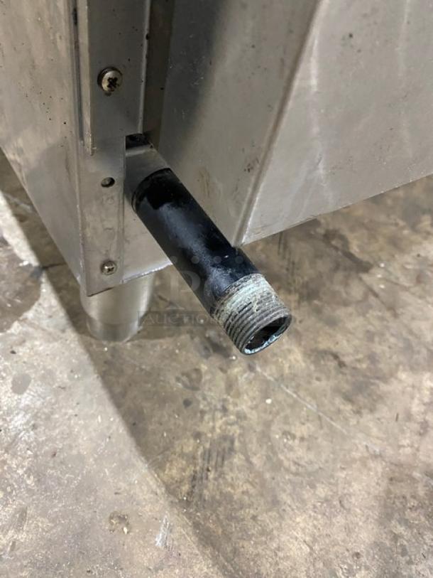 Cecilware Pro Series commercial stainless steel natural gas countertop flat griddle with back and side splash, on legs.