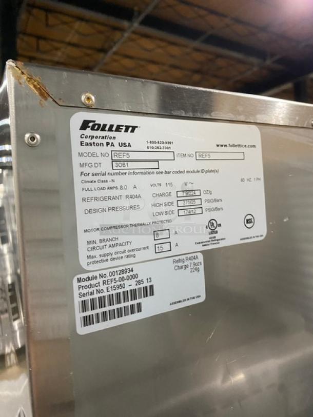 Follett REF5 medical-grade stainless steel undercounter refrigerator, single door, with poly-coated wired rack. Model REF5, SN: E15950-28513, 115V, 1 phase.