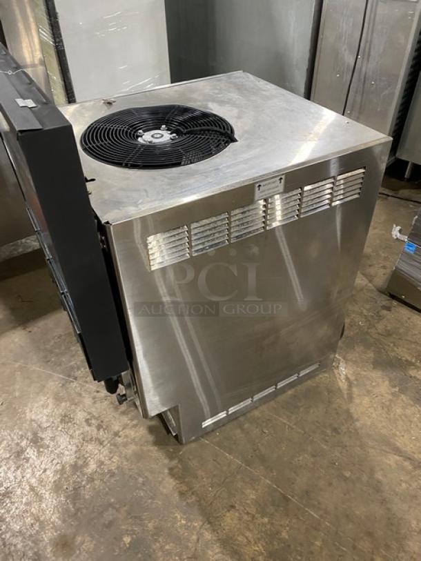 FBD stainless steel 4-flavor Icee dispenser, electric-powered, countertop model. Good condition, SN: 12020200.